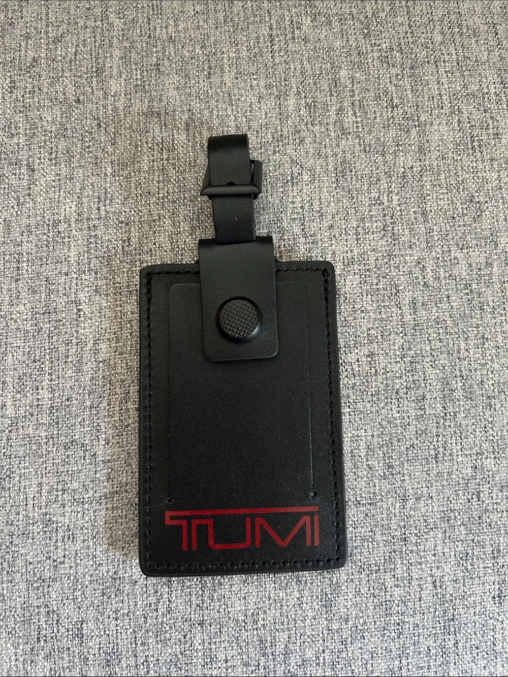 Tumi Black Leather Luggage Tag with Red Logo